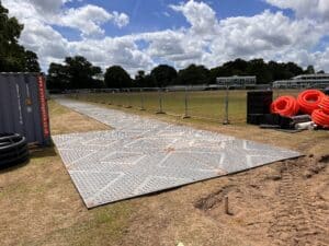 Temporary construction haul road installed with ground protection mats at Rodborough School