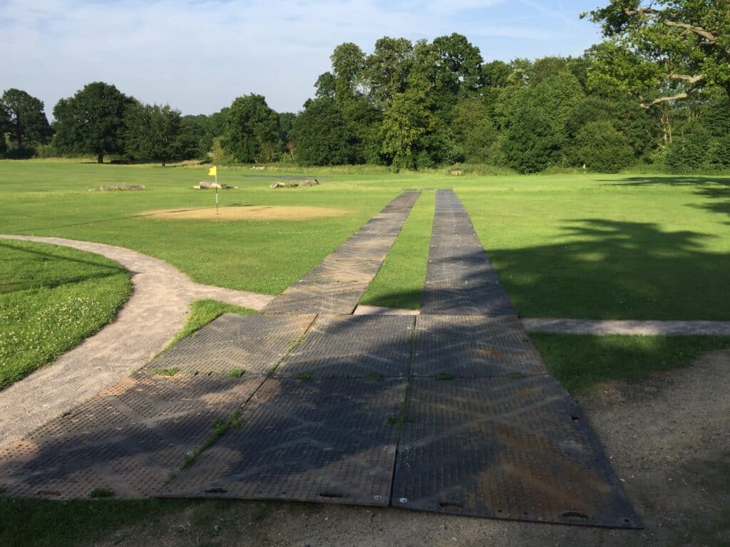 Ground protection trackway laid across the school grounds at Hall Grove School
